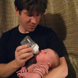 The proud father. Being regarded by his daughter.